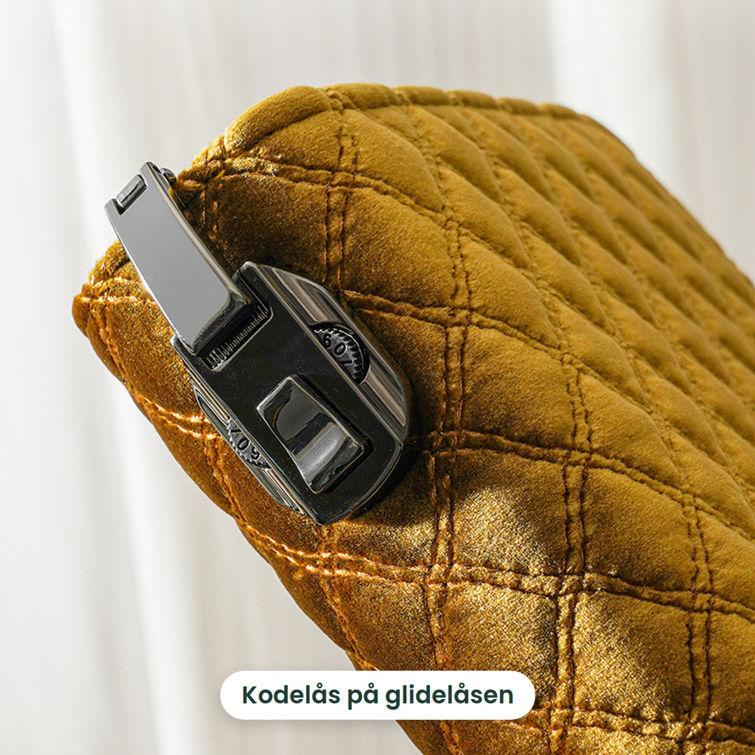 Kodelåsen på glidelåsen til smykkeboken